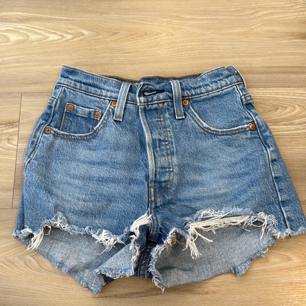 Selling these Levi 501 shorts. Color: Blue. Size 23